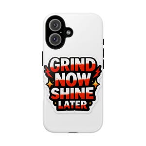 May include: White phone case with a black camera and a sticker that says "GRIND NOW SHINE LATER" in red and white. The sticker has a black border with red lightning bolts and gold stars.