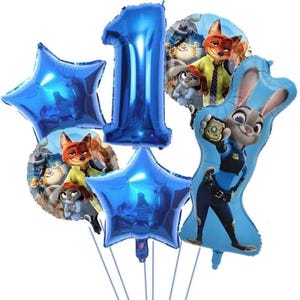 May include: A collection of blue foil balloons, including star-shaped and number "1" balloons. Character balloons feature Judy Hopps and Nick Wilde from Zootopia. Perfect for a first birthday celebration.