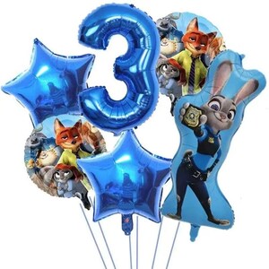 May include: A collection of blue foil balloons, including a large number 3 and star-shaped balloons. Several character balloons from the movie Zootopia are also present, featuring Judy Hopps and Nick Wilde. Perfect for a child's birthday party.