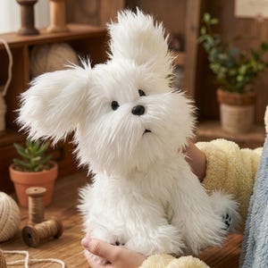 May include: A fluffy white stuffed dog with black eyes and nose. The plush toy has long, shaggy fur and large, floppy ears. The dog is sitting upright and appears to be held by someone. The background includes wooden shelves and small potted plants.