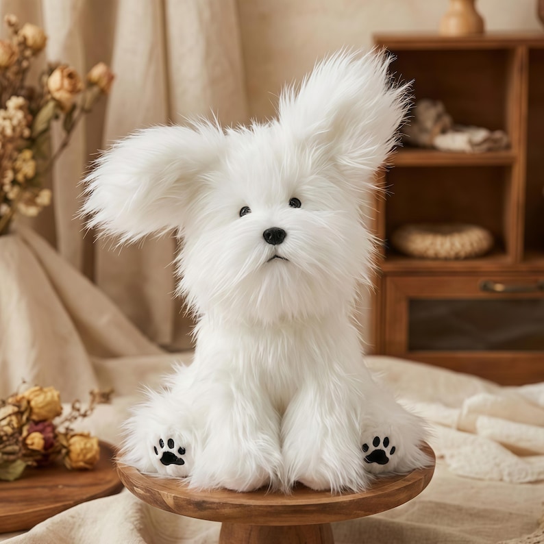 May include: A fluffy white stuffed dog with large, floppy ears and black paw prints on its feet. The plush toy is sitting on a small wooden stand. The dog has a sweet, innocent expression.
