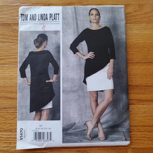May include: Vogue pattern featuring a black and white asymmetrical dress design. The pattern includes a photo of the dress on a model, with the text "TOM AND LINDA PLATT" at the top. The pattern number is V1470.