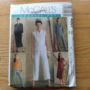 May include: A McCall's Classic Fit sewing pattern envelope, number 4007, featuring illustrations of various outfits including a white sleeveless top and trousers, a black dress, a grey suit, a yellow top with grey trousers, and a red patterned dress.