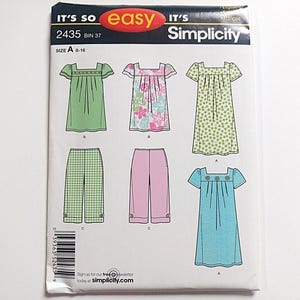 May include: Simplicity sewing pattern 2435, with dress and trouser designs. The pattern includes a green dress, a floral dress, and a blue dress. The pattern also includes pink and green checked trousers. The size is A 8-16.