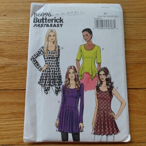May include: A sewing pattern titled "B6096 Butterick Fast & Easy" featuring illustrations of four different women's tops and dresses. The designs include a long-sleeved top with a geometric pattern, a peplum top, and two dresses.