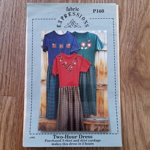 May include: A vintage sewing pattern titled "Two-Hour Dress" featuring three t-shirt and skirt designs. The pattern cover is light blue with a dashed border and the text "fabric EXPRESSIONS P160". The dresses are red, blue, and green.