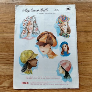 May include: Vintage hat pattern titled "Angelina di Bello SIX CHAPEAUX 'COUTURIERS' HATS". The illustration features six different hat designs, including a cap, beret, and cloche. The pattern includes instructions and a bonus instruction sheet.