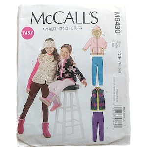May include: McCall's sewing pattern M6430 for children's clothing. The pattern includes designs for a hooded jacket, vest, and trousers. The cover features illustrations of the finished garments and the text "EASY".