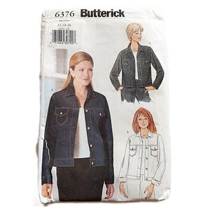 May include: A vintage Butterick sewing pattern envelope featuring a denim jacket design. The envelope displays illustrations of the jacket and includes the size range 12-14-16. The jacket has two chest pockets and button closures.