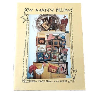 May include: A book cover with the text "SEW MANY PILLOWS" and "FROM PIECES FROM MY HEART". The image features a display of various decorative pillows with different patterns and designs, including stars, pumpkins, and patchwork.