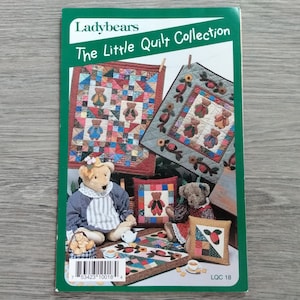 May include: A book cover titled "Ladybears The Little Quilt Collection" featuring images of teddy bears and quilts. The quilts have bear designs and are in various colors. Teddy bears are also shown with the quilts.