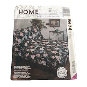 May include: A vintage McCall's Home Decorating pattern envelope. The package features a floral print sofa cover design. The text on the package includes instructions for chair covers, a futon cover, and a shirred panel screen. The pattern number is 6474.