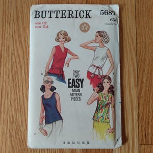 May include: Vintage Butterick sewing pattern 5687. The pattern features illustrations of four different tops. The pattern includes the size 12, bust 34. The text on the pattern reads "Only Two Easy Main Pattern Pieces."
