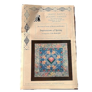 May include: A vintage quilting pattern titled "Impressions of Spring" by Lila Rudolph. The pattern, from Granny Nanny's Quilting Gadgets, features a colorful quilt design with blue, pink, and green floral patterns. The cover includes text and a copyright notice.