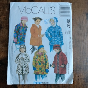 May include: McCall's sewing pattern for children's coats. The pattern features illustrations of various coat designs, including a floral print, polka dots, and a snowflake pattern. The pattern size is Y (Xsm-Sml).