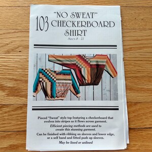 May include: A sewing pattern for a No Sweat Checkerboard Shirt, sizes 8-22. The document features text and images of two long-sleeve tops with pieced designs, showcasing a checkerboard pattern that transitions into stripes in various colors.