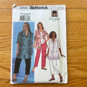 May include: A Butterick 3096 sewing pattern envelope for sizes 16W, 18W, and 20W. The front displays three illustrations of outfits featuring button-down shirts and trousers, including a blue zebra print shirt, a pink tropical print shirt, and a white floral shirt.