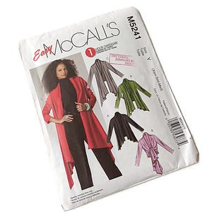 May include: A McCall's sewing pattern for a cardigan. The pattern features a woman wearing a red cardigan over a black outfit. The pattern shows different cardigan styles in gray, green, black, and pink. The pattern number is M5241.