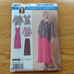 May include: A Simplicity sewing pattern envelope, number 1622, from the Khaliah Ali Collection. The front displays illustrations of a patterned top, a solid pink dress, a ruffled top, and wide-leg pants, alongside a photo of a person wearing the outfit.