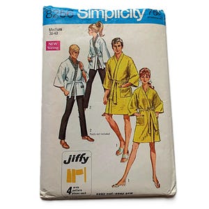 May include: A Simplicity Jiffy sewing pattern envelope, number 8250, featuring illustrations of individuals wearing robes and jackets. The white paper envelope displays the text 'Simplicity', '8250', 'Medium 38-40', 'NEW Sizing', 'jiffy', and '4 main pattern pieces each'.