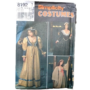 May include: A Simplicity Costumes sewing pattern envelope, number 8192, featuring illustrations of three different long-sleeved, floor-length dresses with historical-inspired designs. The package includes size information and a barcode on the top left.