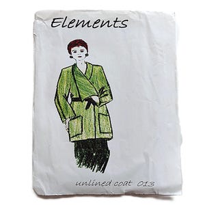 May include: A sketch of a green coat with a black belt and pockets, labeled "Elements." The drawing depicts a person wearing the coat. The text "unlined coat 013" is at the bottom.