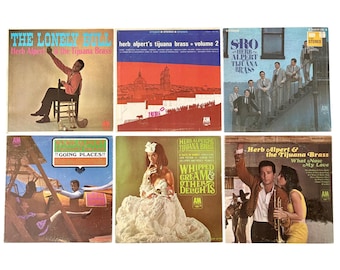 May include: A collection of six Herb Alpert and the Tijuana Brass vinyl record albums featuring cover art titled The Lonely Bull, Volume 2, SRO, Going Places, Whipped Cream and Other Delights, and What Now My Love, all displaying the A&M Records logo.