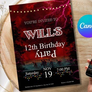 May include: A birthday party invitation with a red and black gradient background, featuring the text "YOU'RE INVITED TO WILL'S 12th Birthday Party". A smartphone displays the same invitation. The invitation is on a wooden tray.