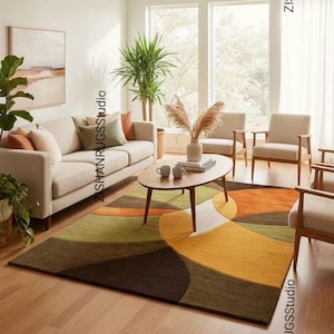 May include: A set of three ceramic mugs with a speckled, matte finish. The mugs are in shades of cream, light gray, and dark gray. Each mug has a simple, minimalist design, perfect for coffee or tea.