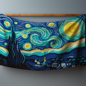 May include: A pixelated tapestry depicting Van Gogh's "Starry Night" with swirling blues, yellows, and greens. The artwork features a village, cypress tree, and a bright moon. The tapestry is hung on a wooden rod.