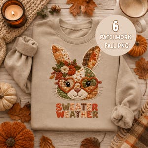 Pode incluir: Uma camisola bege de gola redonda com um gráfico de coelho em estilo patchwork, com óculos em forma de coração, detalhes florais e uma abóbora. O texto "SWEATER WEATHER" está impresso abaixo numa fonte multicolorida com padrão.
