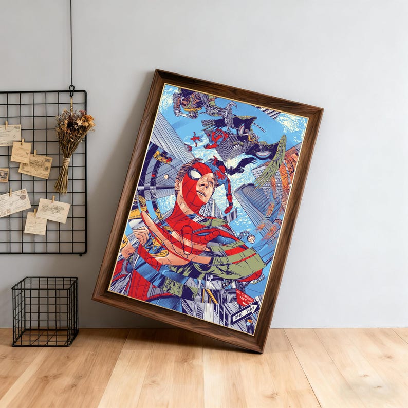 May include: Framed artwork featuring Spider-Man in a dynamic action pose, set against a backdrop of a cityscape and other characters. The artwork is predominantly red, blue, and green, with a brown wooden frame. The image has a comic book style.