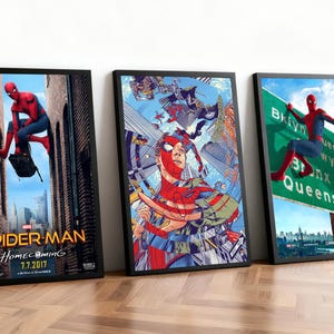 May include: Three framed Spider-Man movie posters. The first shows Spider-Man in a city alley, the second features a collage of Spider-Man illustrations, and the third shows Spider-Man near a road sign. All posters have black frames.