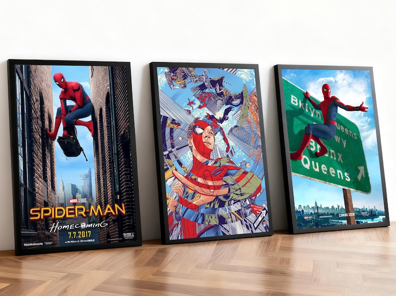 May include: Three framed Spider-Man movie posters. The first shows Spider-Man in a city alley, the second features a collage of Spider-Man illustrations, and the third shows Spider-Man near a road sign. All posters have black frames.