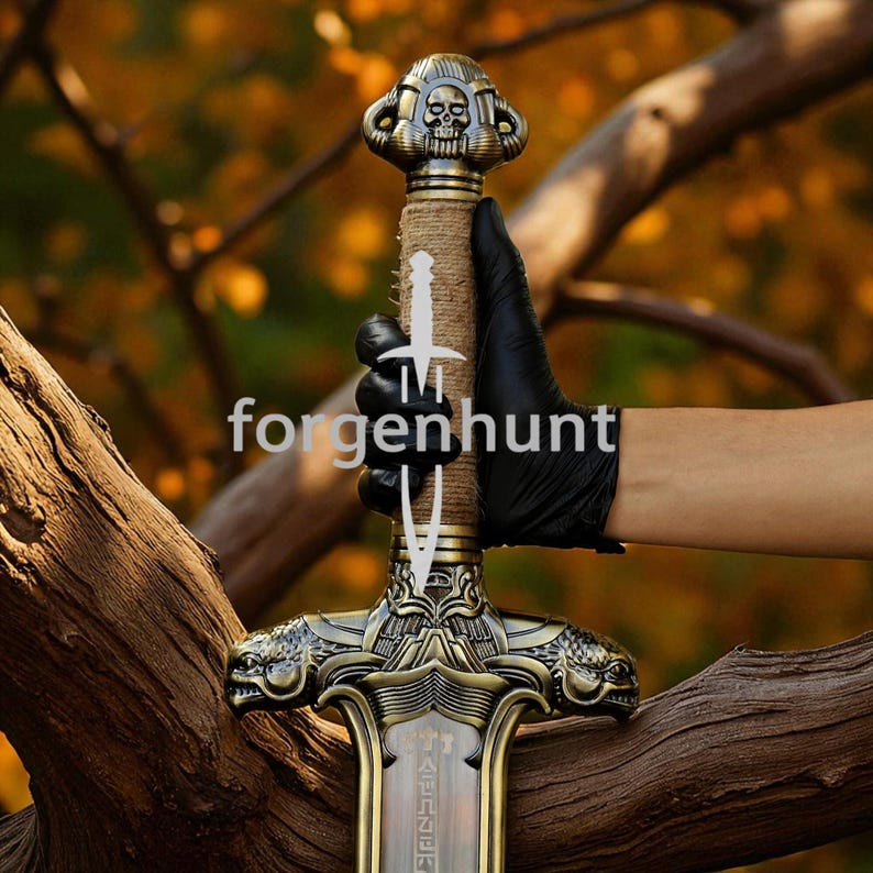 May include: A decorative sword with a skull-shaped pommel and intricate gold-colored detailing. The handle is wrapped in twine. The blade has a bronze finish. The word "forgenhunt" is printed on the image.