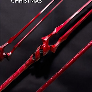 May include: A red spear-like object with a complex design, featuring a twisted central section and sharp points. The image includes the text "ARRIVE BEFORE CHRISTMAS".
