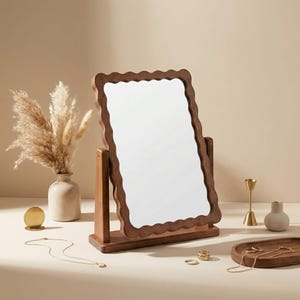 May include: A white ceramic mug with a black handle and the text "But First, Coffee" in a bold, black font. The mug is sitting on a wooden surface. The mug is 4 inches tall.