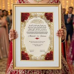 May include: A framed wedding certificate with gold trim, featuring Arabic calligraphy and the names "Aramet" and "Fatima." The design includes red roses, pearls, and the words "Bride" and "Groom."