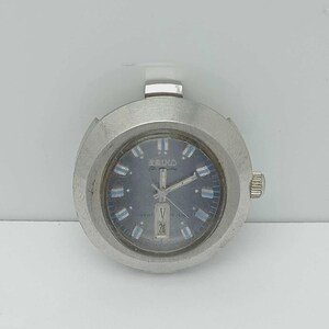 May include: A silver-toned Seiko Bell-Matic watch head with a round case and a blue dial. The dial features silver hour markers with light blue accents, silver hands, and a date window at the six o'clock position. A crown is on the right side.