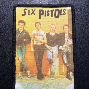 Digitaltryckt vintagemärke Sex Pistols