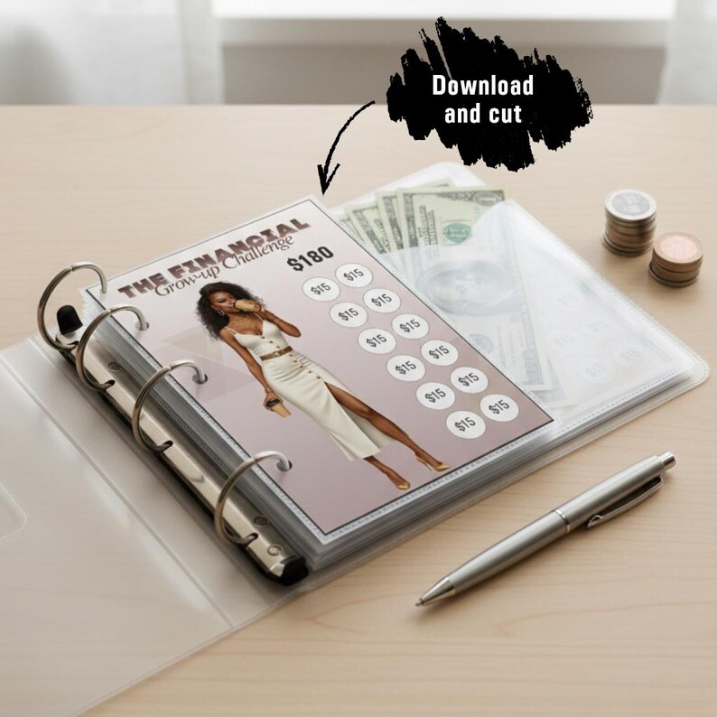 A printable $180 financial savings challenge tracker for an A6 binder, shown inside a clear six-ring binder with a pen and coins on the wooden table, illustrating the 'Download and cut' instruction.