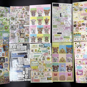 May include: A set of three ceramic mugs with a speckled, matte finish. The mugs are in shades of cream, light gray, and dark gray. Each mug has a simple, minimalist design and a rounded handle. Perfect for coffee or tea.