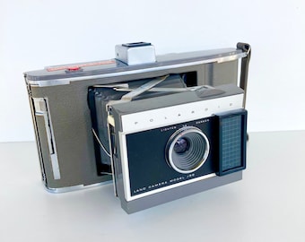 Vintage Polaroid Land Camera Model J66 - Check out all of our Polaroid cameras