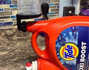 Desagüe del vaso de detergente para ropa *Tide, Gain, Downy*