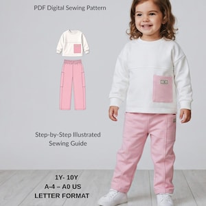 May include: Mila Pocket Set PDF digital sewing pattern for a long-sleeve white sweatshirt with a pink pocket and matching pink pants. Includes a step-by-step illustrated sewing guide for sizes 1Y-10Y, available in A-4, A0, and US letter formats.