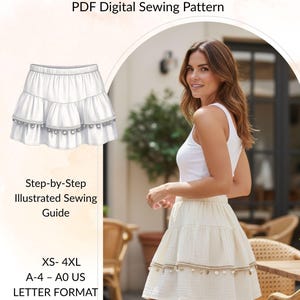 May include: The image showcases a white tiered mini skirt with a decorative trim, paired with a white tank top. The text "Ocean Breeze Mini Skirt" and "PDF Digital Sewing Pattern" are displayed at the top. Additional text includes "Step-by-Step Illustrated Sewing Guide" and size details.
