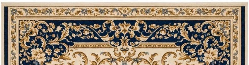 May include: A rectangular area rug featuring a deep navy blue center and border with an intricate cream and gold floral scrollwork pattern. The design includes symmetrical acanthus leaf motifs and delicate blossoms arranged in a classic border.