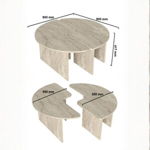 May include: A set of two stone-colored coffee tables. The larger table is round, 35 inches in diameter and 16.4 inches tall. The smaller tables are semi-circular, 21.6 inches wide. All tables have a unique, textured surface.