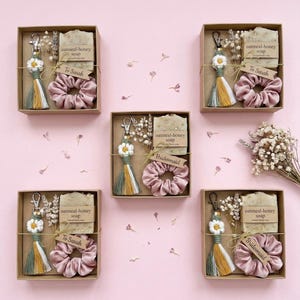 Small handmade macrame daisy keychain in a gift box for a bridesmaid proposal,
