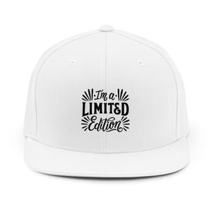 May include: A white baseball cap with a flat peak. The cap displays the text "I'm a LIMITED Edition" in black, with decorative elements. A classic, casual hat.